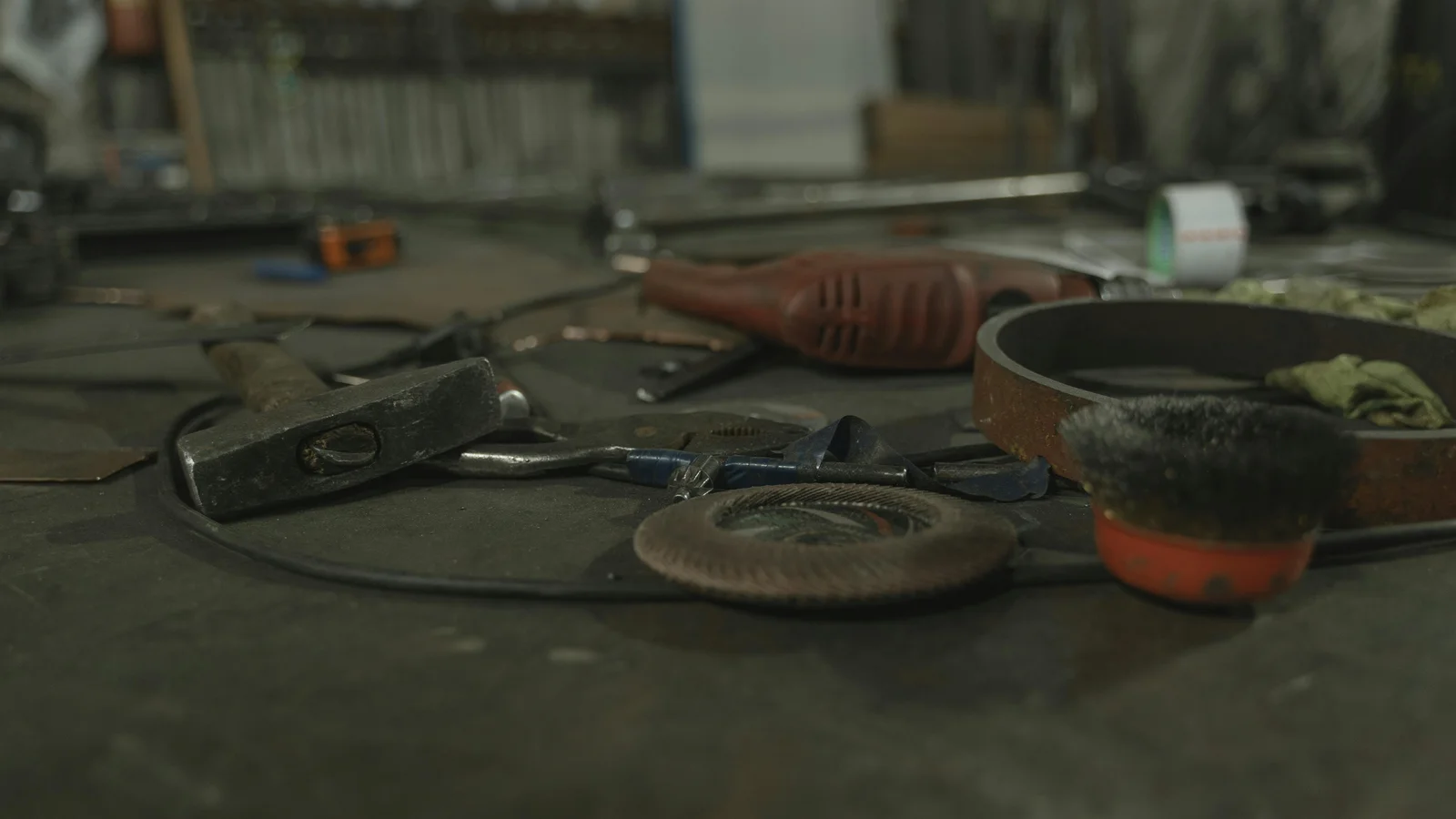 A workbench in a workshop with a wide selection of hand tools laid out together, used as a metaphor for evaluating different configurator tools side by side.