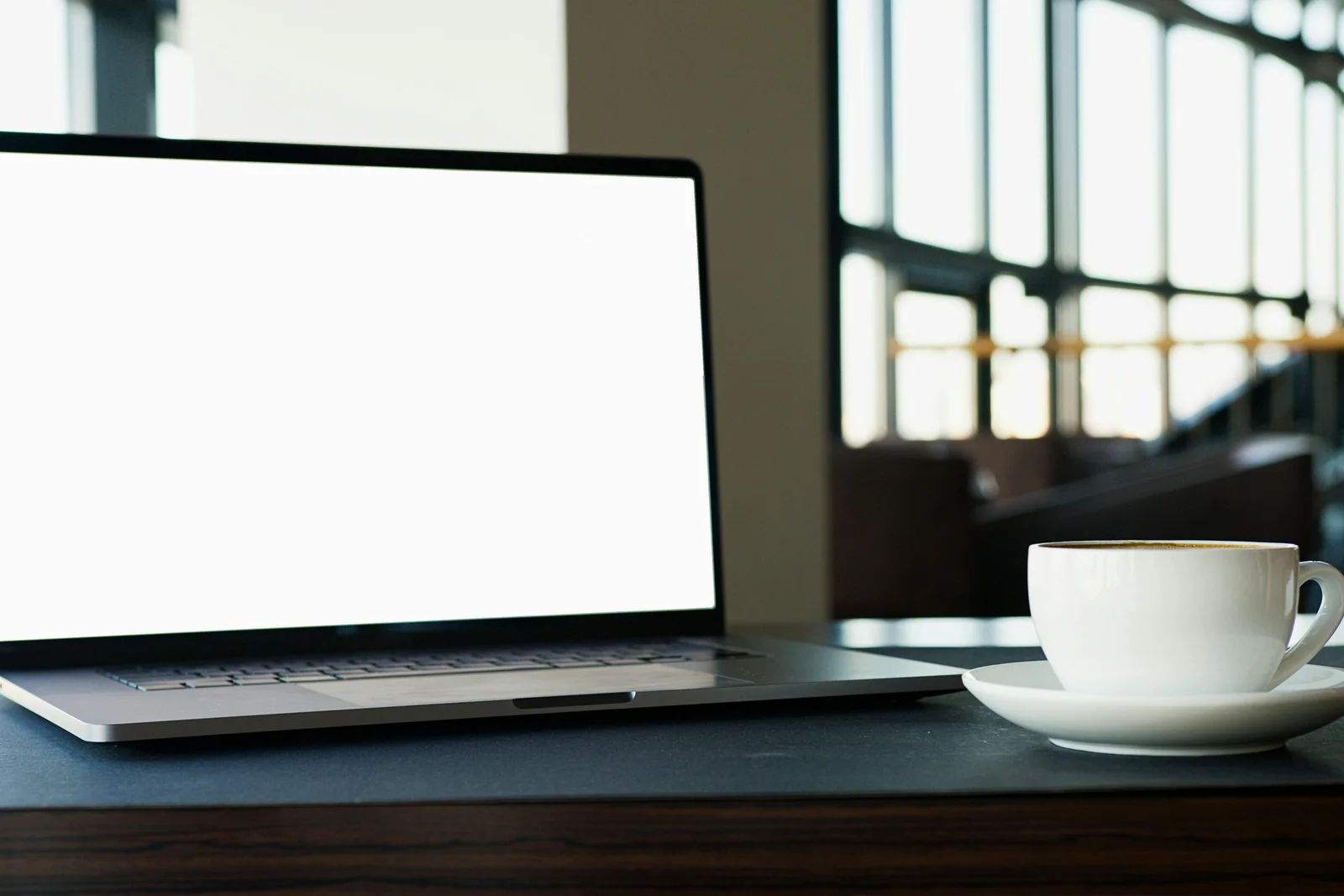 A blank-screened laptop and a steaming coffee on a clean desk, the standard Monday morning of a salesperson opening an inbox that did not refill itself over the weekend.